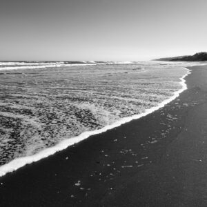 Black and white coastal ocean waves.